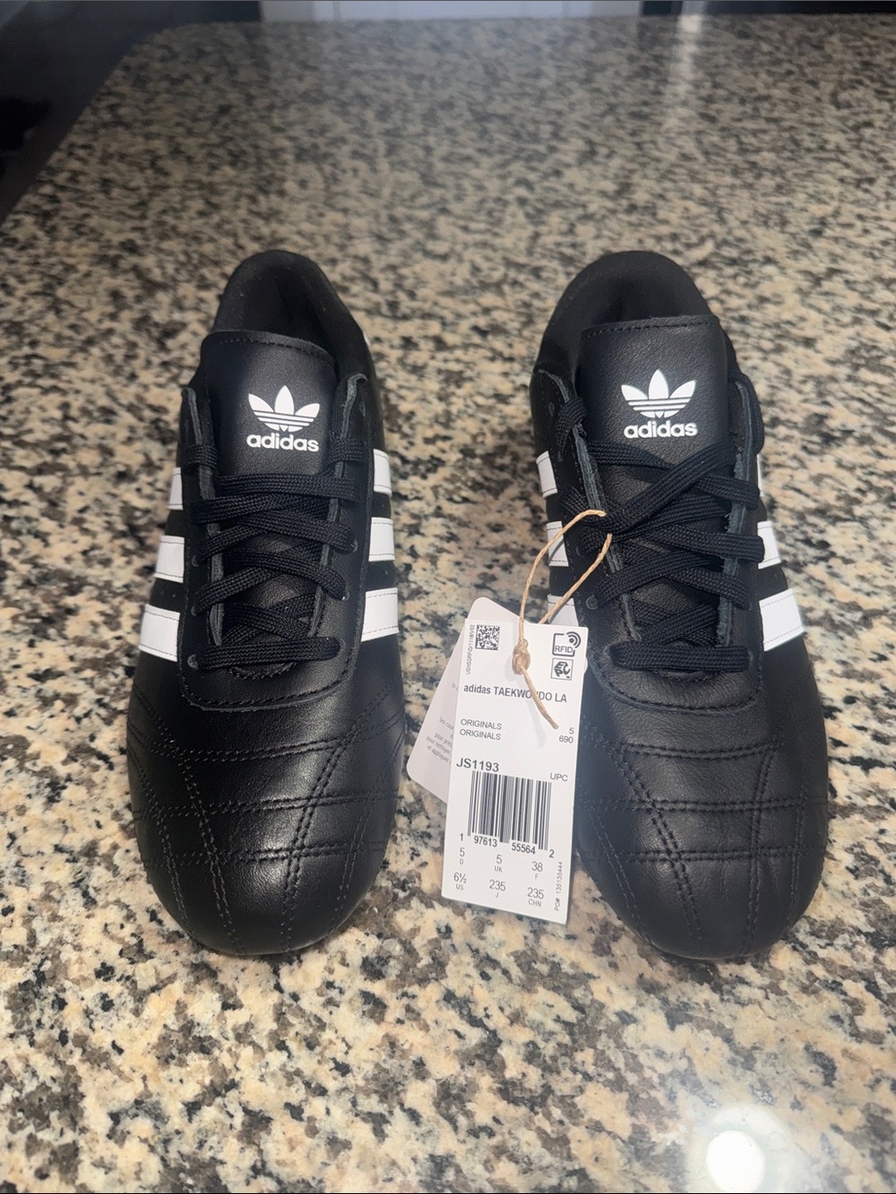Adidas’s Teekwondo LA Black Sneakers with White Stripes